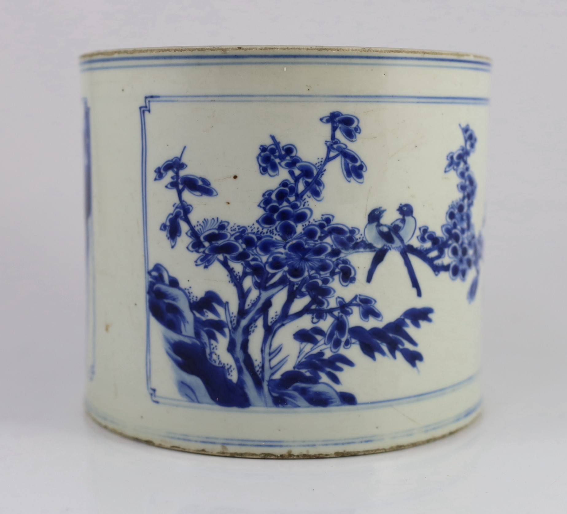 A Chinese blue and white ‘landscape’ brushpot, bitong, Kangxi period, 17.8cm diameter, 15.2cm high, fritting to edges